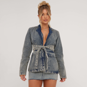 blonde lady wearing a denim blazer and skirt set with tie waist